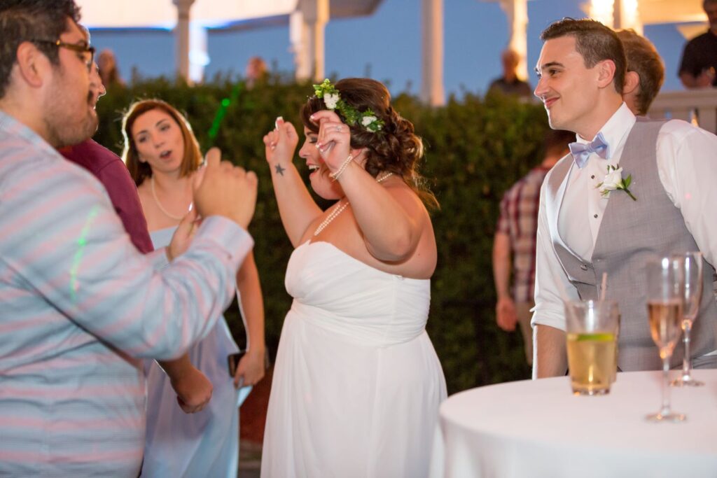 Bride and wedding guests dancing